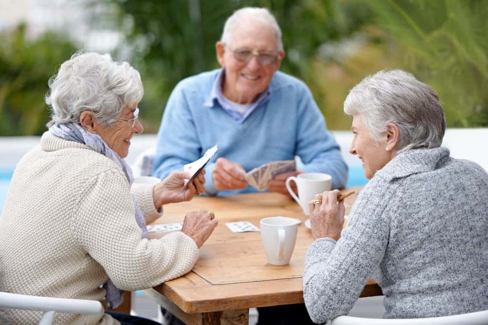 senior residents playing a card game
