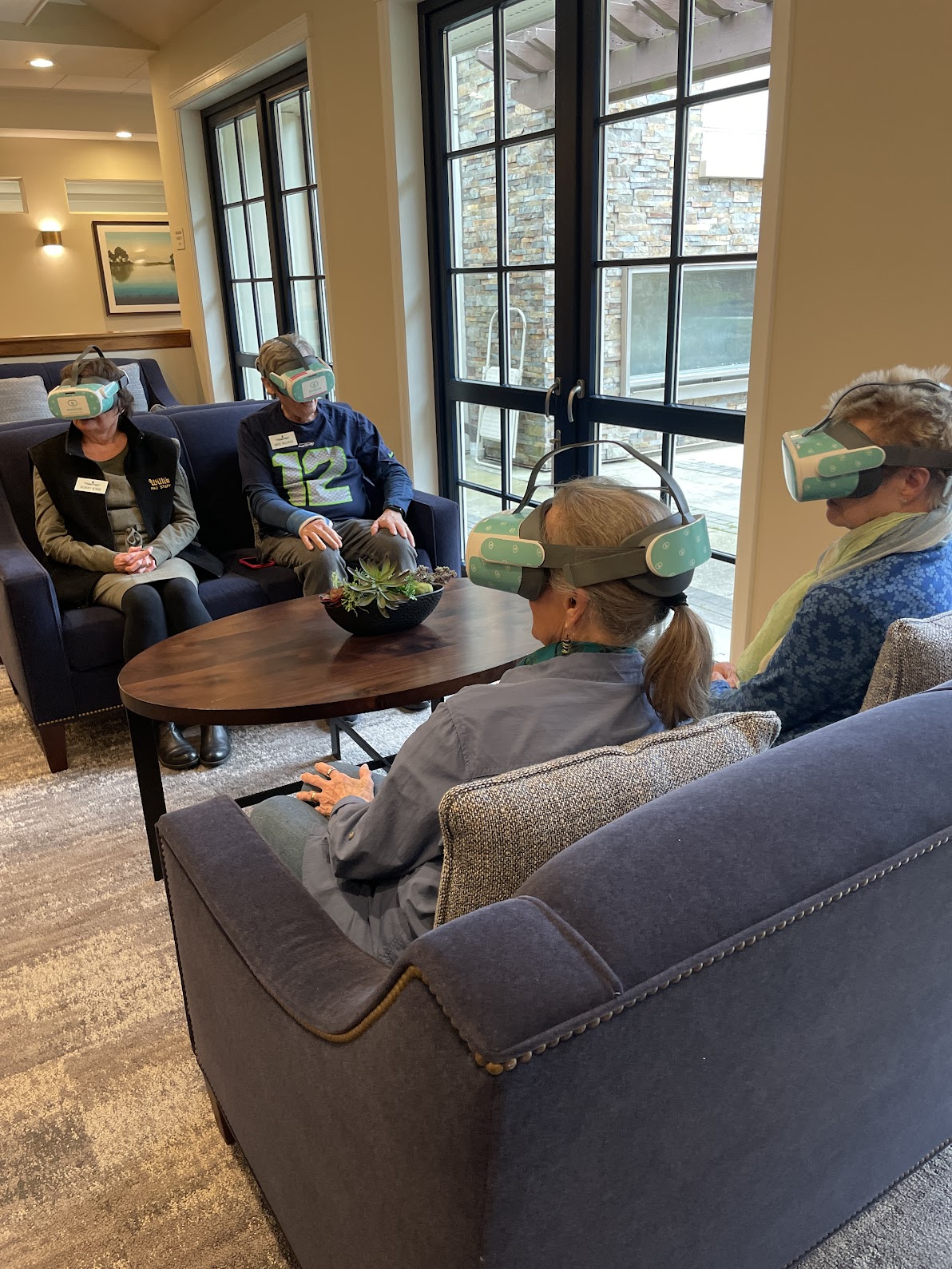 Emerald Heights residents participating in a shared virtual reality experience using Rendever technology